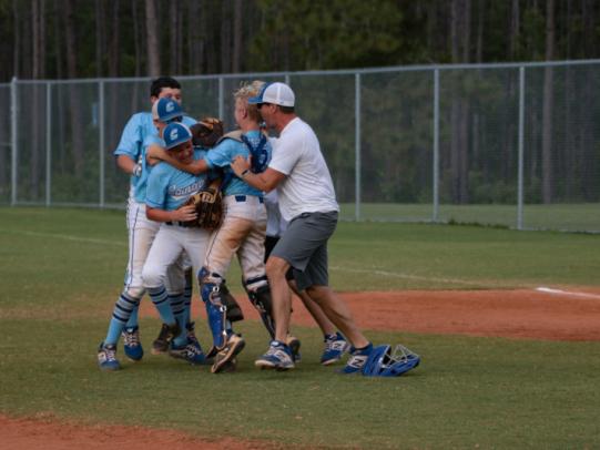USSSA baseball team celebrating in Orange Beach, AL