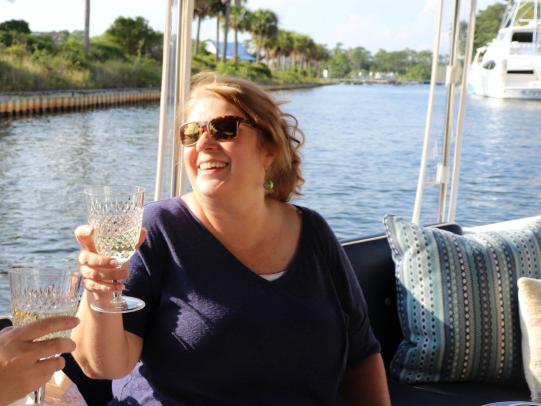 Woman on a sunset sail along Alabama's beaches