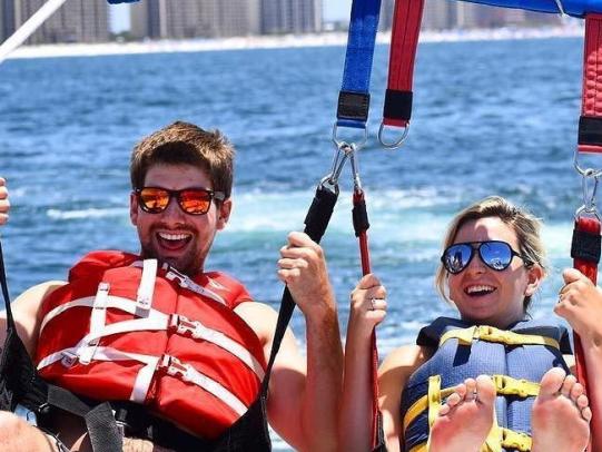 Couple parsailing in Orange Beach, AL