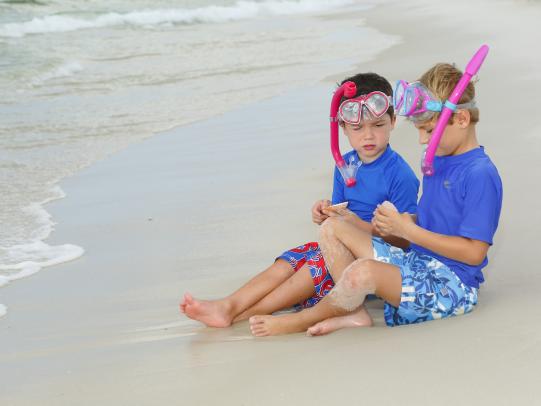 Two kids preparing to play in the water