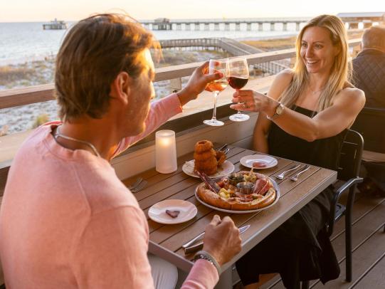 Couple eating at Perch, fine dining restaurant in Gulf Shores
