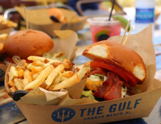 Burger and fries on picnic table