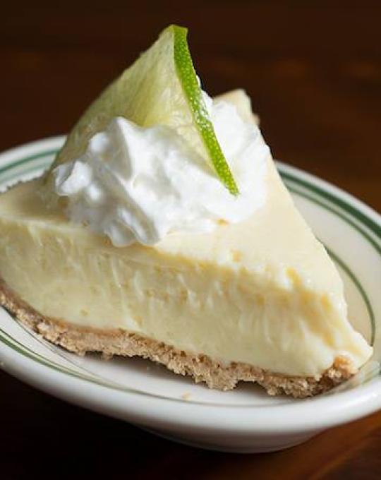 Slice of key lime pie on a plate