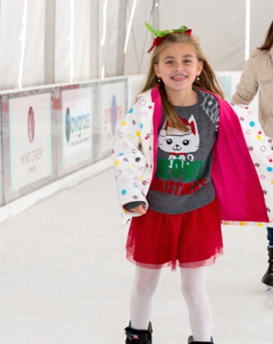 Girl and Mom ice skating at The Wharf in Orange Beach