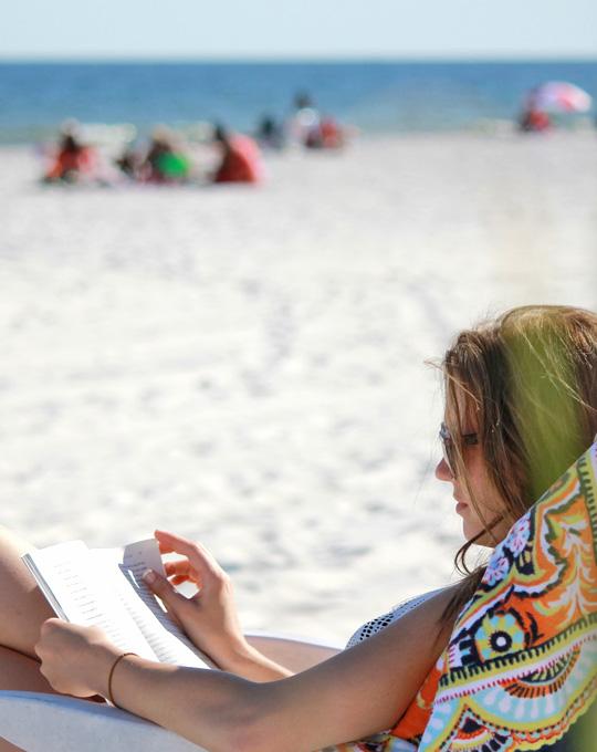 Woman Reading on Alabama's Beaches
