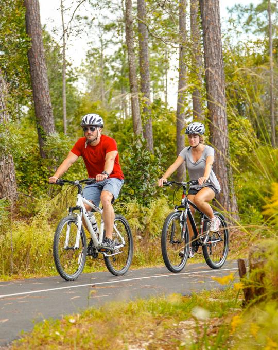 Couple riding bikes in Orange Beach