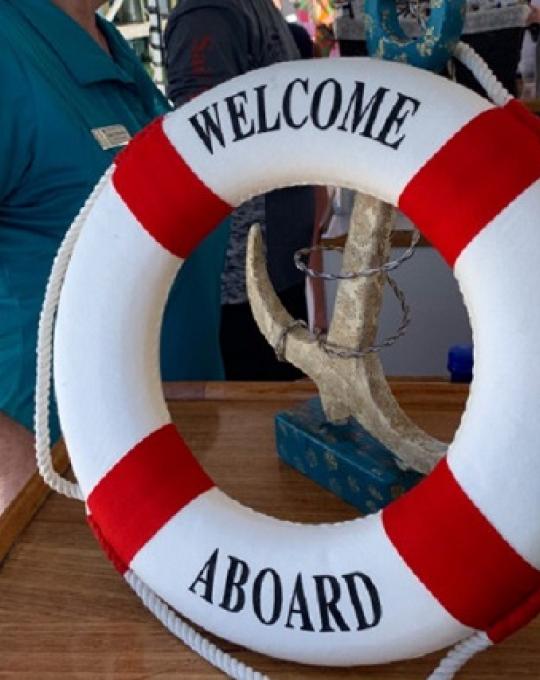 welcome aboard life ring orange beach