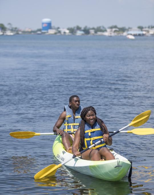 Couple kayaking in Orange Beach, AL