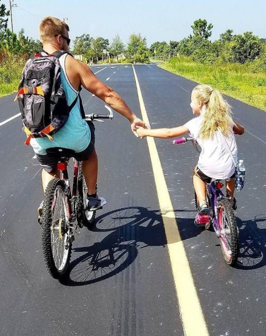 father and daughter on the biking trails gulf state park alabama