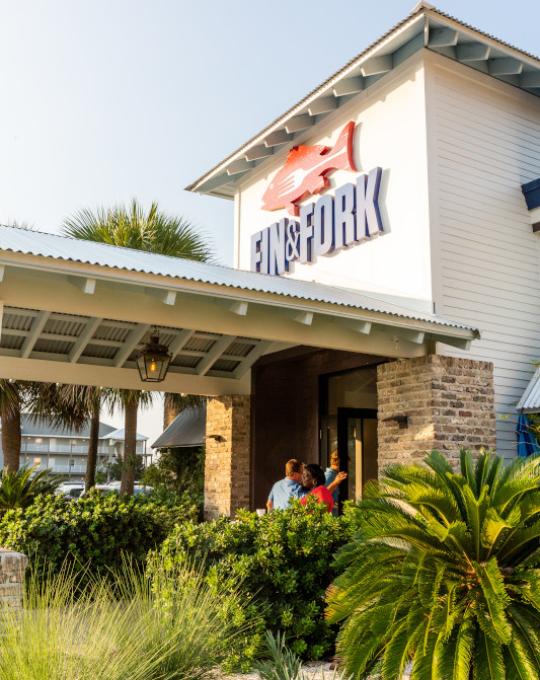 the outside of Fin & Fork in Orange Beach Al