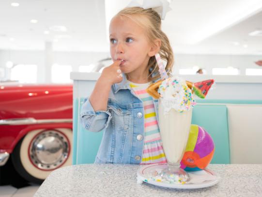 girl with a milkshake at the Sunliner Diner Gulf Shores