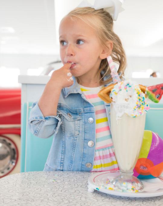 girl with a milkshake at the Sunliner Diner Gulf Shores