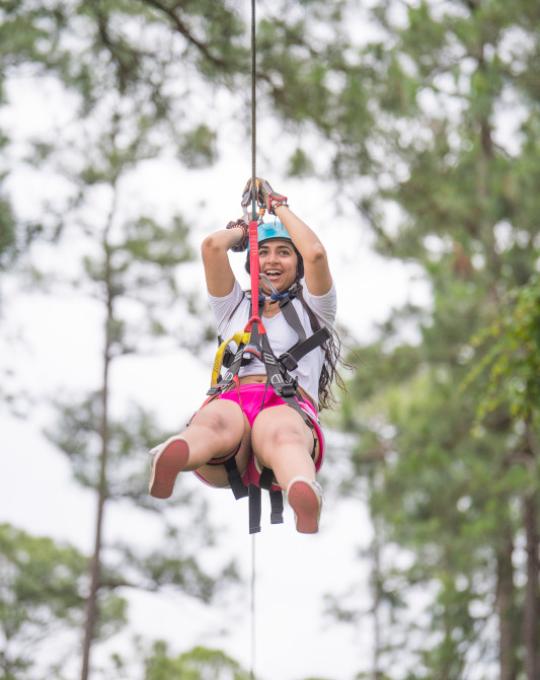 woman on Hummingbird zipline Orange Beach