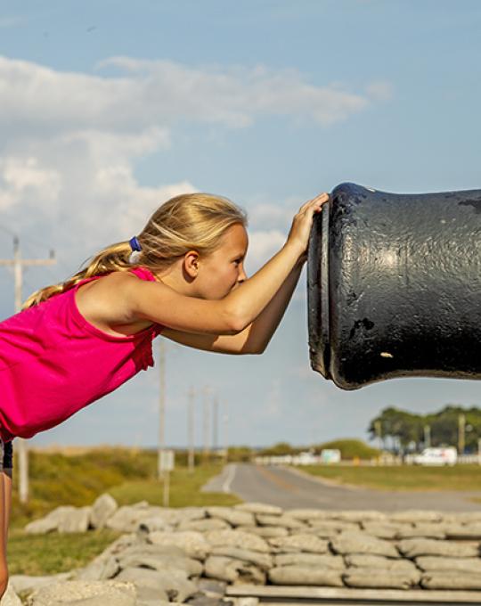 Girl exploring Fort Morgan