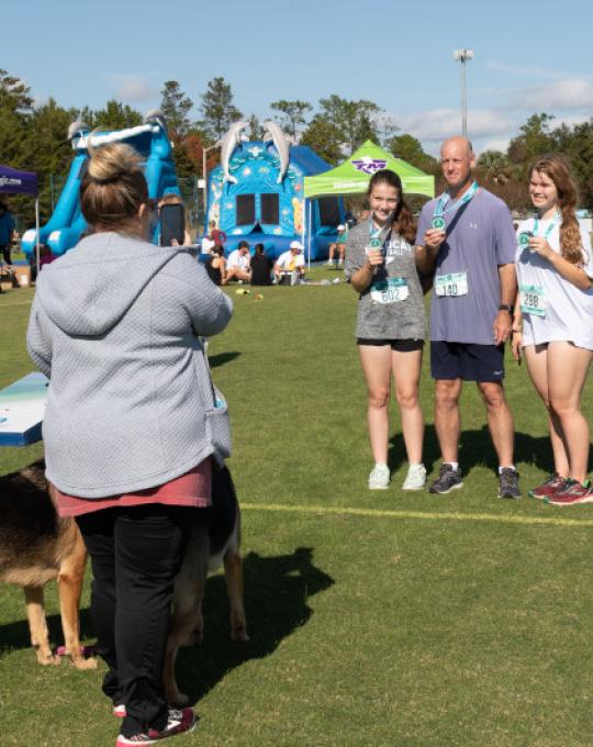 Athletes getting photos after half marathon finish