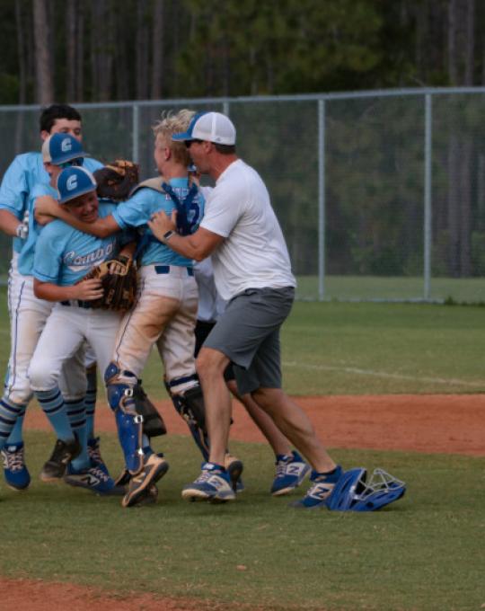 USSSA baseball team celebrating in Orange Beach, AL