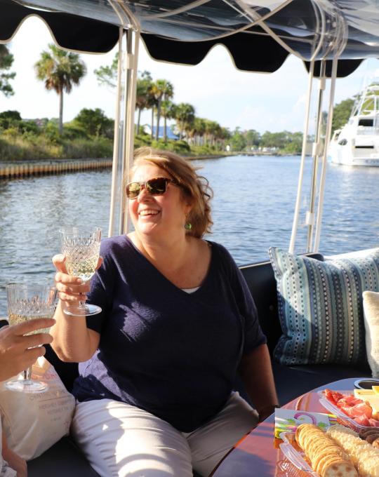 Woman on a sunset sail along Alabama's beaches