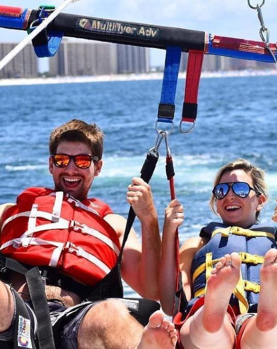 Couple parsailing in Orange Beach, AL