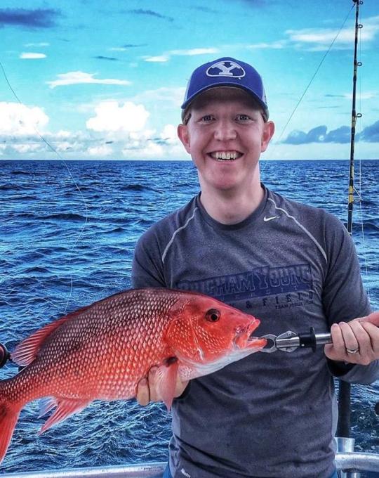 Teen deep-sea fishing in Orange Beach, AL