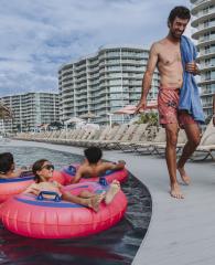 Family enjoying the amenities at their condo rental on Alabama's Beaches
