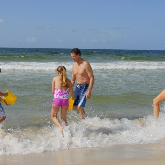 Family plays on Alabama's beaches