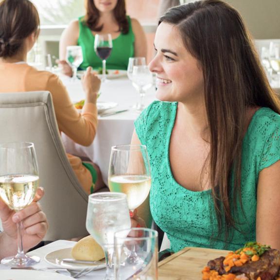 Couple with wine in Orange Beach restaurant