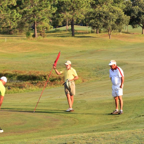Group of Men play golf in Gulf Shores, AL