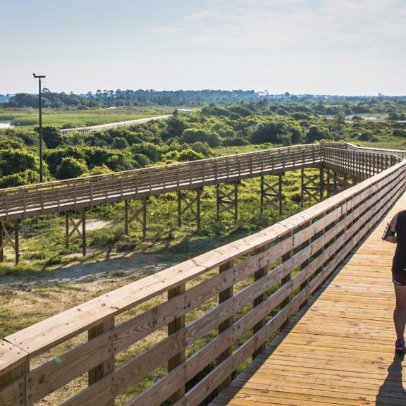 Woman running near Gulf State Park in Alabama