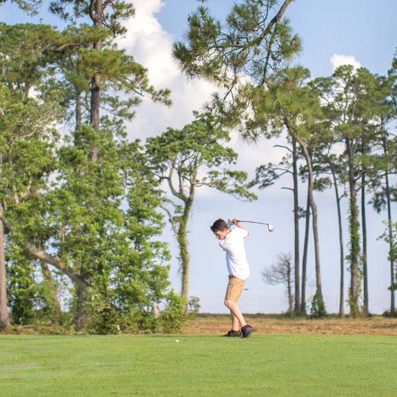 Dad and Son golfing in Gulf Shores Alabama