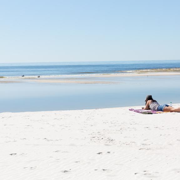 reading on the beach, gulf shores, orange beach