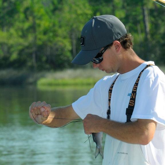 Fisherman preparing his line in Orange Beach, AL