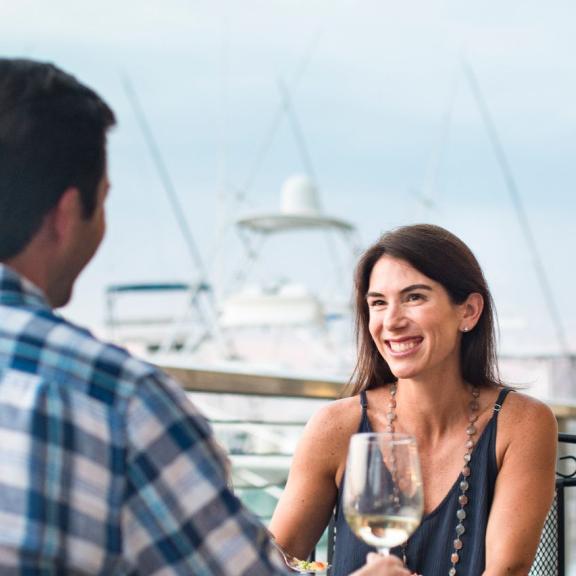 Couple dining at The Wharf in Orange Beach