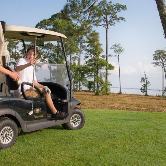 Father and son golfing in Gulf Shores, AL