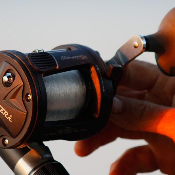 Man using a fishing rod on Alabama's beaches