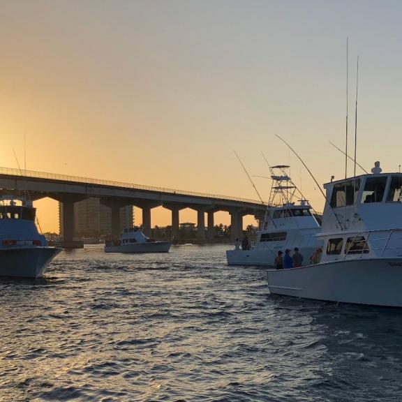Boaters going into the Gulf of Mexico on Alabama's beaches