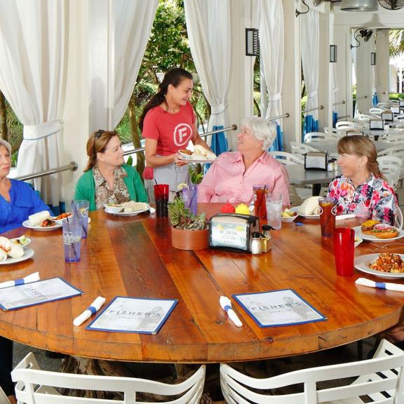 Friends eating at Fisher's in Orange Beach