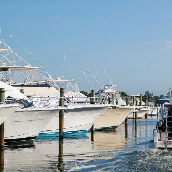 Boat leaving a marina in Orange Beach, AL