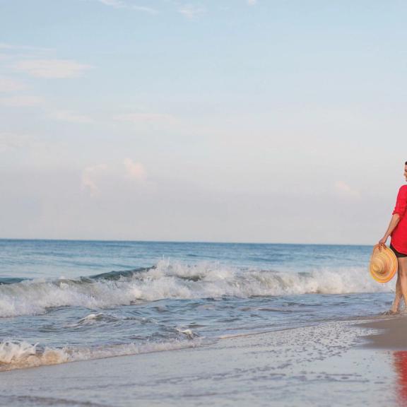 Couple walking on Alabama's beaches