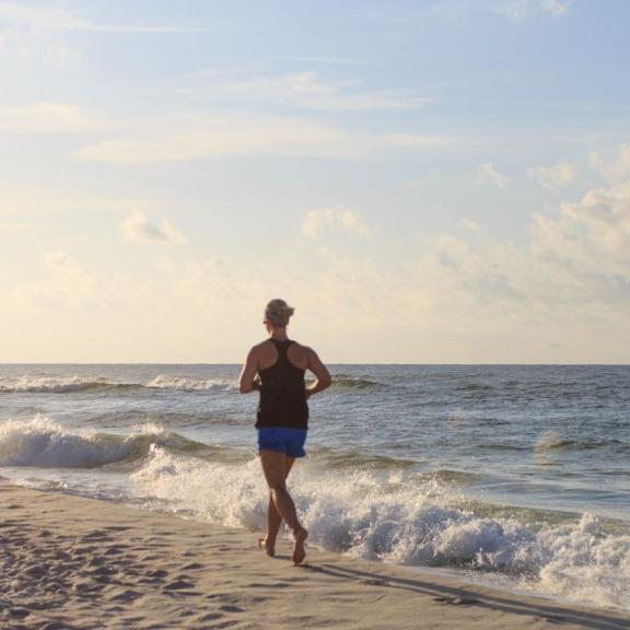 Woman running on the beach in Alabama