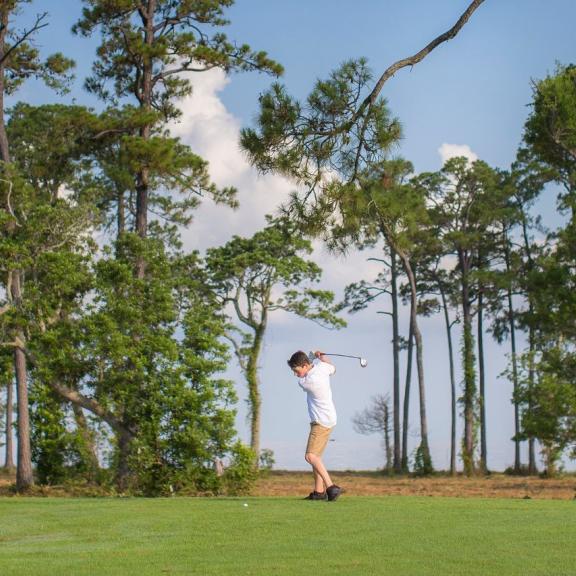Father and son golfing at Peninsula in Gulf Shores