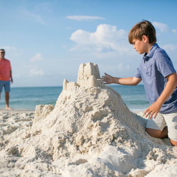 Family building sand castle 