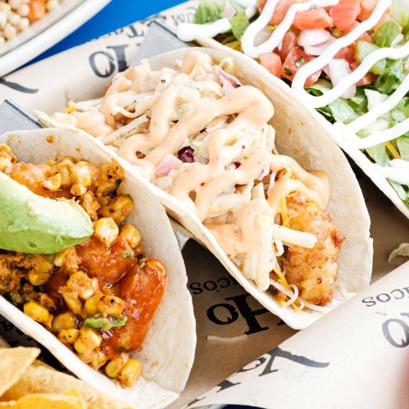 a plate of colorful tacos at Yoho Rum & Tacos at The Wharf in Orange Beach
