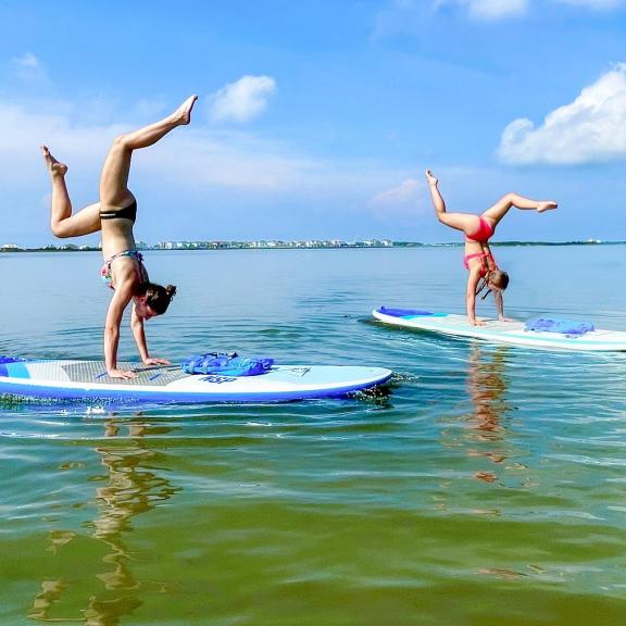 yoga paddleboarding in Gulf Shores with Pure Aloha Adventures