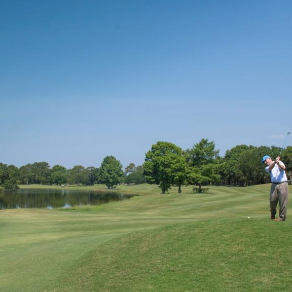 Men playing golf at Craft Farms Golf Resort in Gulf Shores.