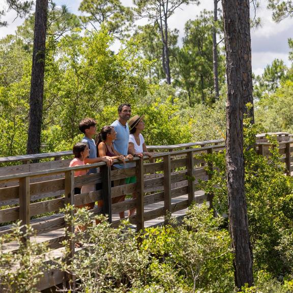 Family sightseeing along the trails in Gulf State Park