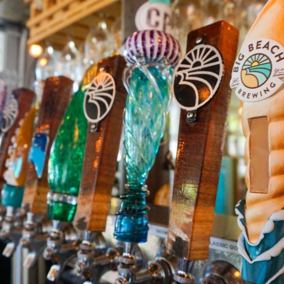 Line of tap handles at Big Beach Brewing, local brewery in Gulf Shores