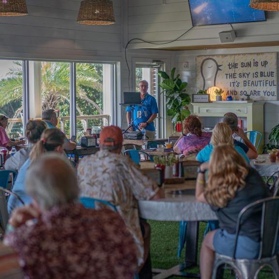 Meeting off the Minds attendees gathered at Picnic Beach restaurant in Gulf shores