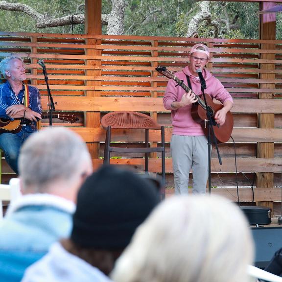 Musicians performing on the outdoor stage at Woodside Restaurant in Gulf State Park
