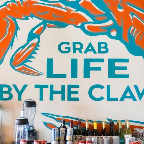 mural at hammered crab seafood restaurant