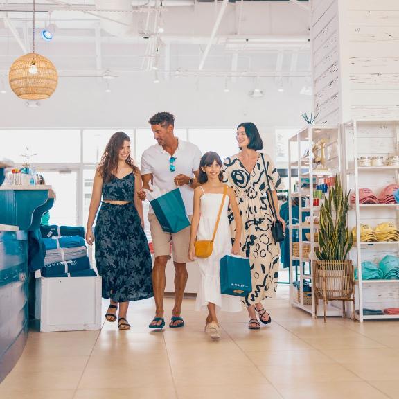Family shopping at the wharf store in orange beach